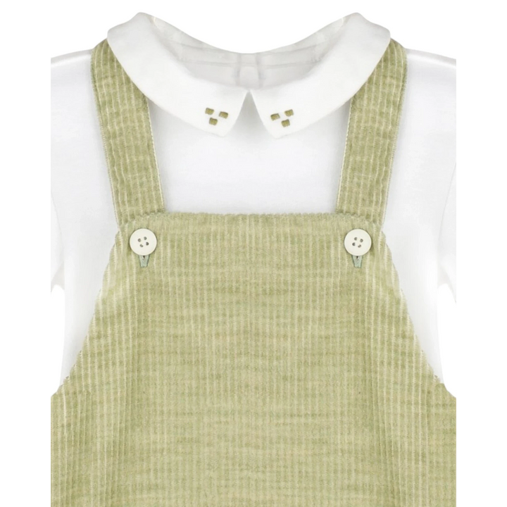 That Store green corduroy longall with a white knit Peter Pan collar featuring delicate green embroidery details.