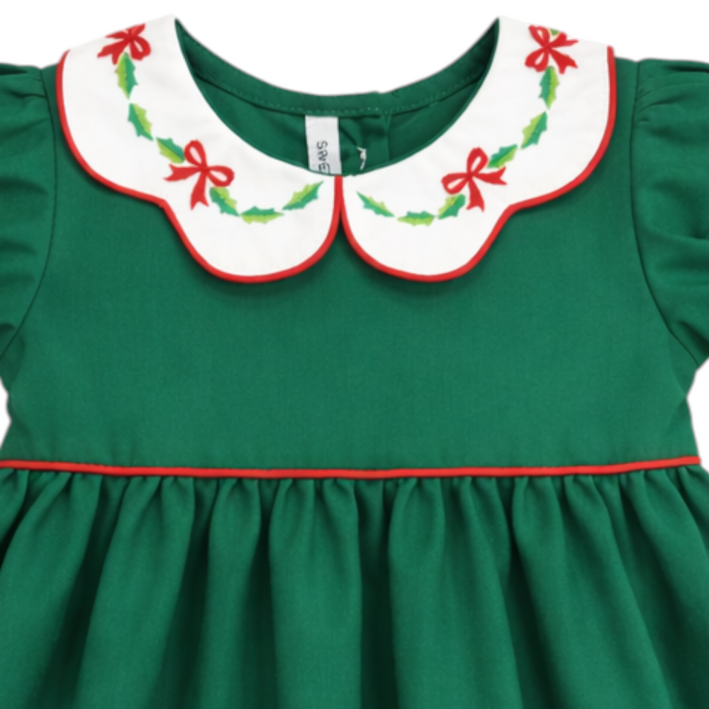 That Store girls green cotton dress featuring a white scallop collar with red bow and green holly embroidery.