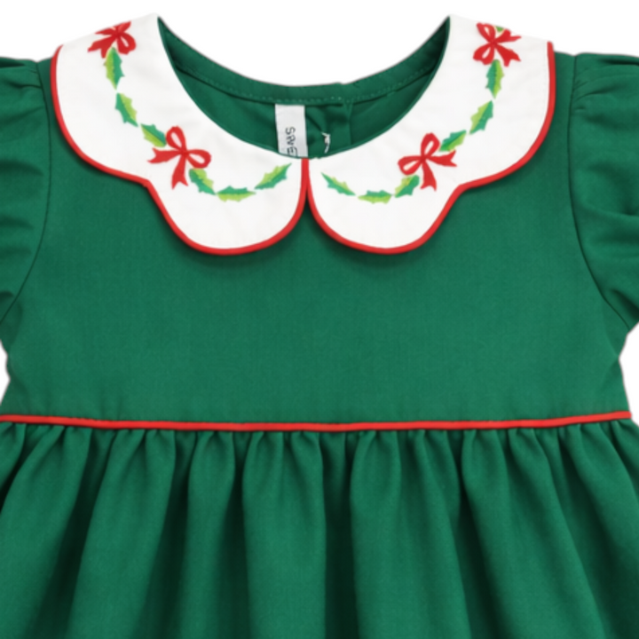 That Store girls green cotton dress featuring a white scallop collar with red bow and green holly embroidery.