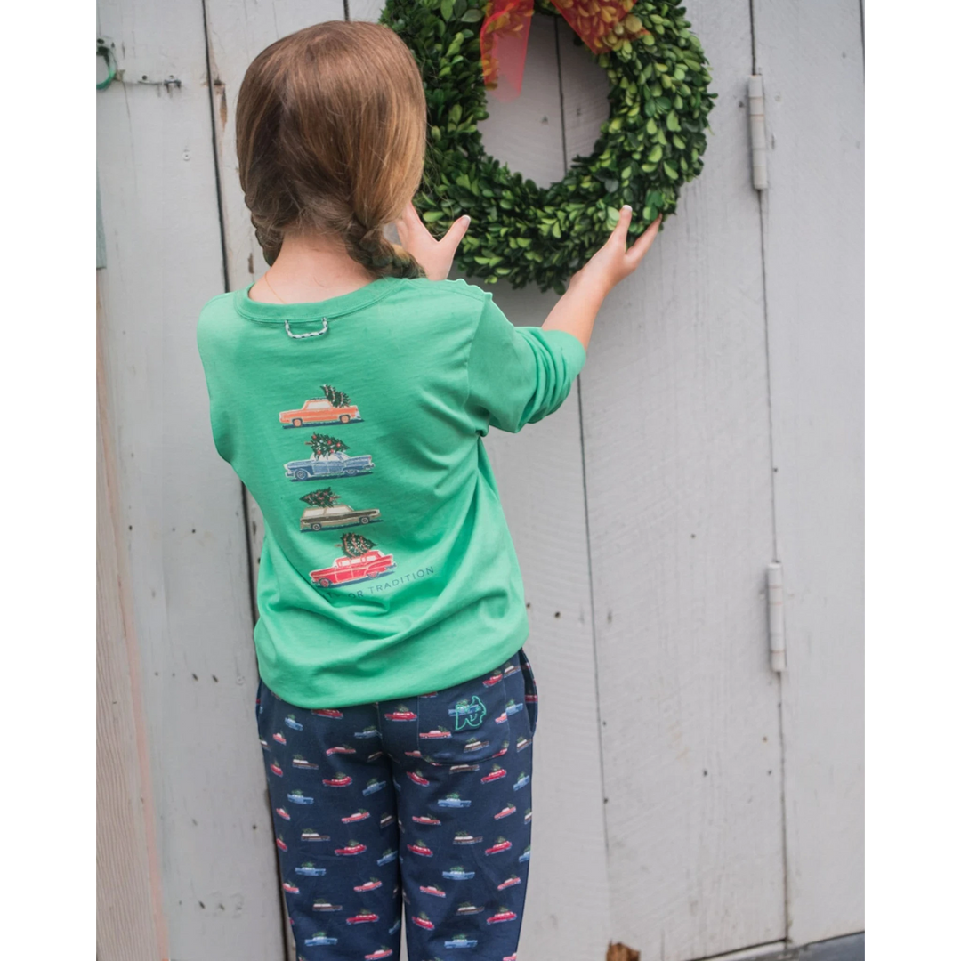 Child wearing a That Store green spruce long sleeve cotton t-shirt with vintage car print, featuring a back loop.