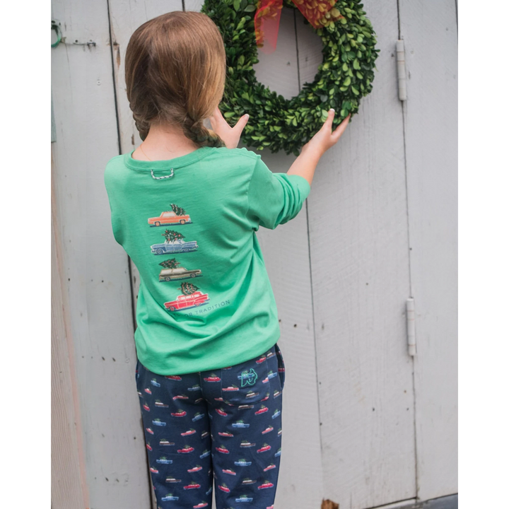 Child wearing a That Store green spruce long sleeve cotton t-shirt with vintage car print, featuring a back loop.