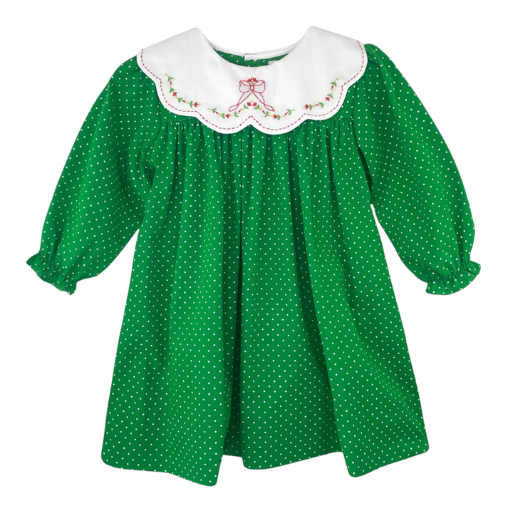 That Store green polka dot dress with a white scalloped collar featuring red floral bow embroidery and long sleeves.