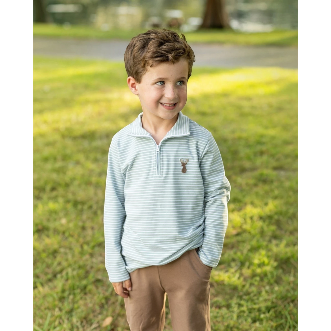 That Store boys green stripe quarter-zip pullover with a deer motif, worn by a young boy in a park setting.