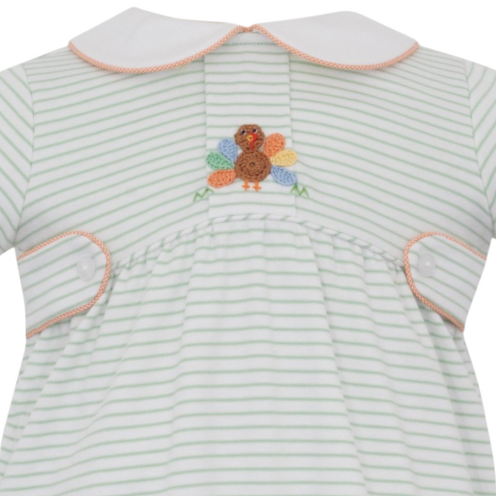 That Store boys green stripe knit bubble romper featuring a detailed crochet turkey appliqué and white collar.