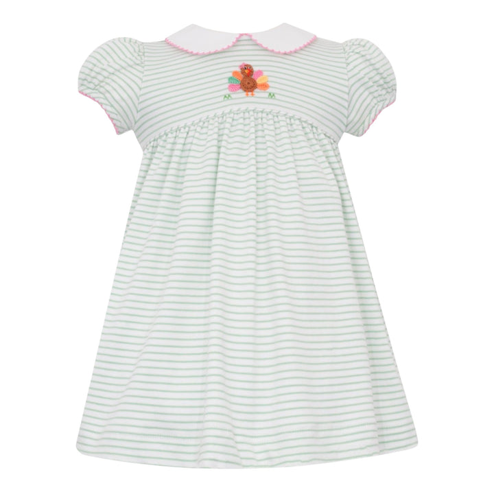 That Store girls knit dress in green stripes featuring a crochet turkey appliqué and a white peter pan collar.