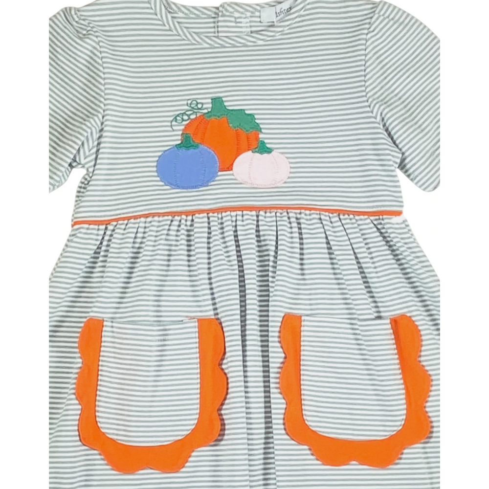 That Store green striped dress for girls featuring a pumpkin applique and orange scalloped pockets for fall.