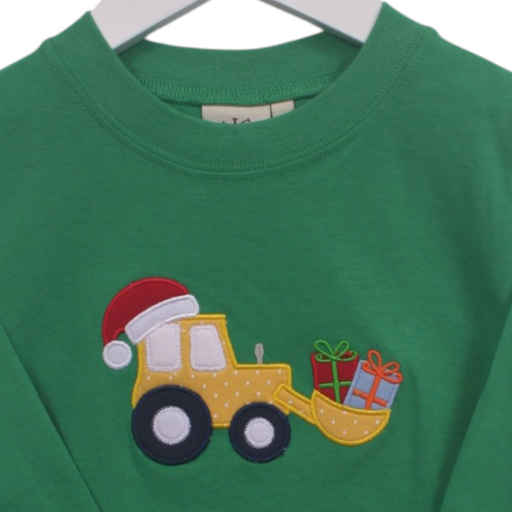 That Store green cotton boys t-shirt featuring a yellow tractor with a Santa hat and Christmas gifts applique