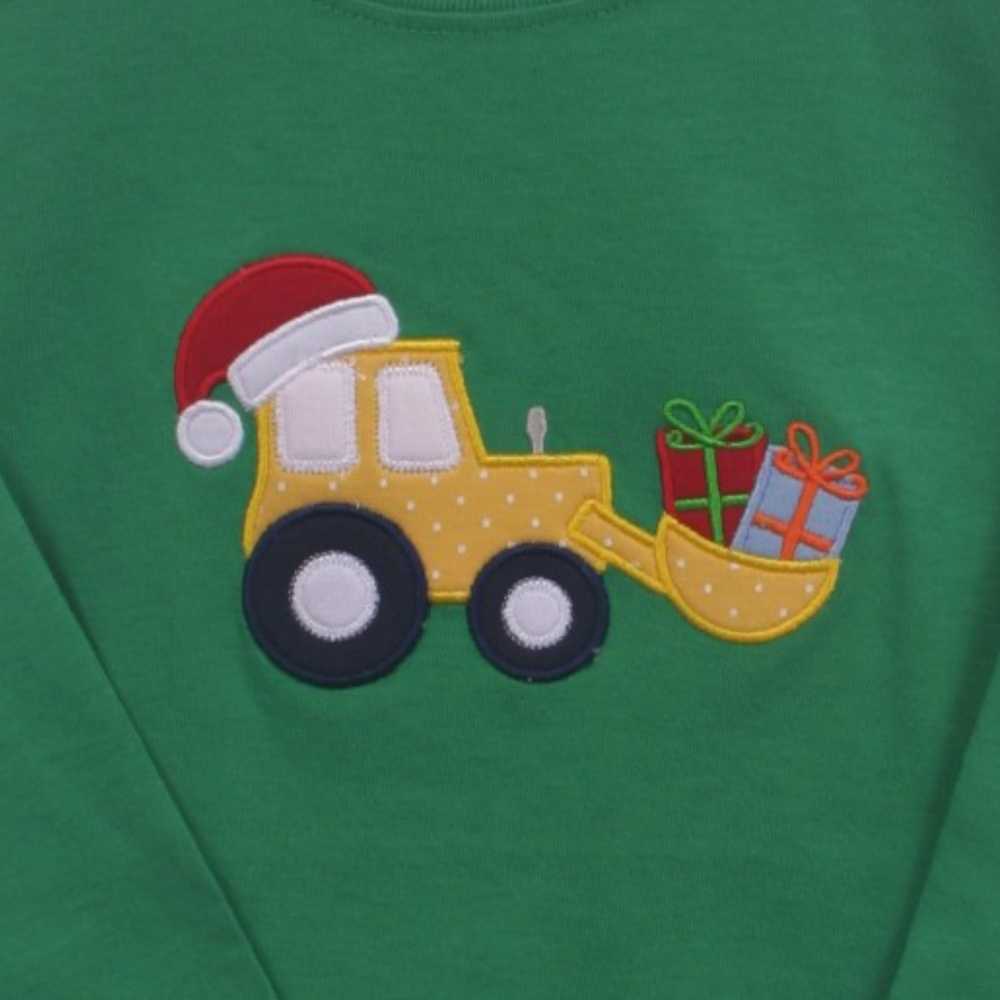 That Store green cotton boys tee featuring an embroidered yellow tractor with a Santa hat and colorful gift boxes