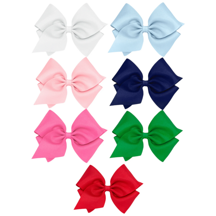 That Store collection of seven large grosgrain hair bows in white, light blue, pink, navy, hot pink, green, and red.