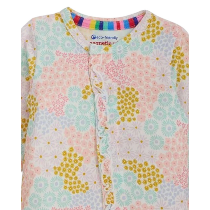 That Store Harper magnetic modal girls footie in a pastel floral print with ruffle trim and magnetic closures.