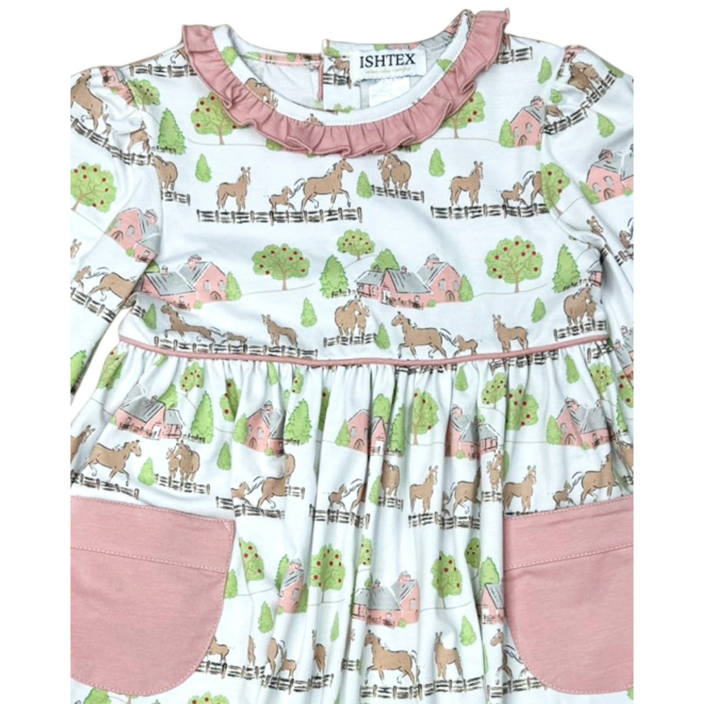 That Store pink cotton dress with horse and barn print, featuring ruffled neckline and two front pockets.