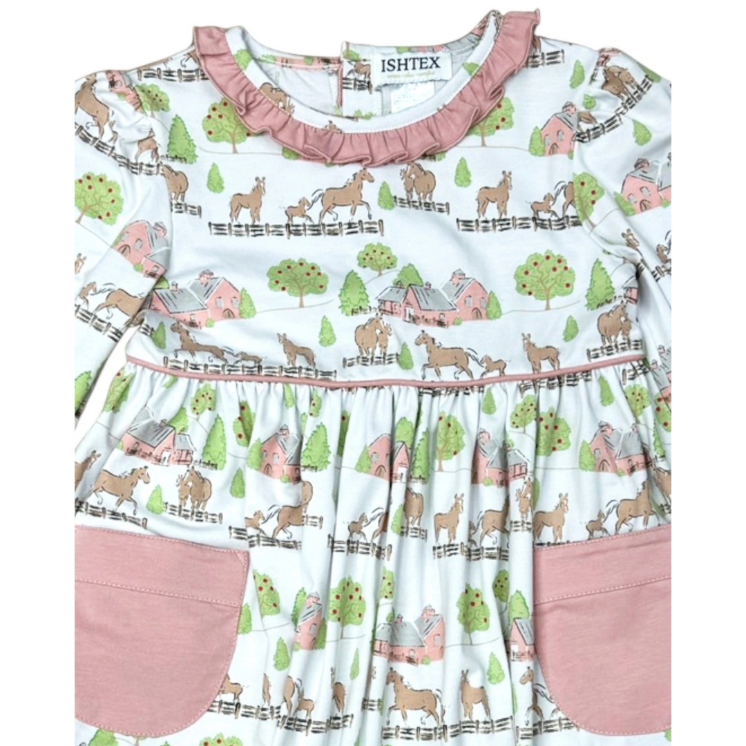 That Store pink cotton dress with horse and barn print, featuring ruffled neckline and two front pockets.