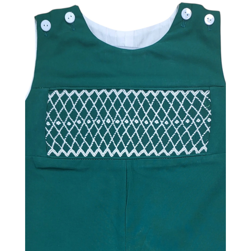 That Store hunter green boys longall with white smocked diamond pattern detailing and shoulder button closures.