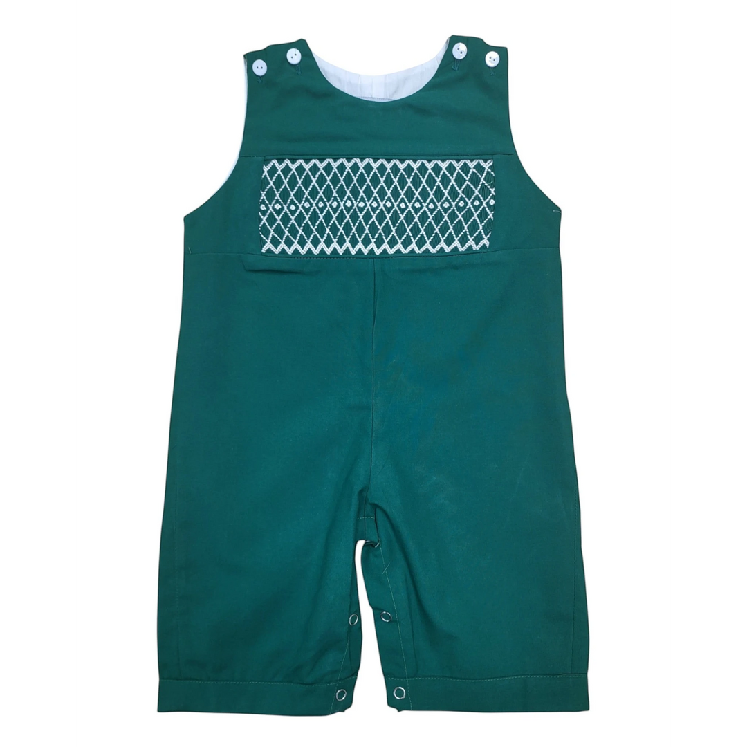 That Store hunter green boys longall with white smocked detailing and button closures, made of cotton blend fabric.