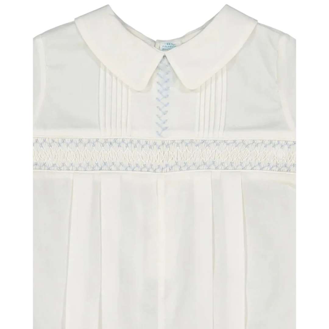 That Store ivory baby boy romper with hand-stitched pintucks, blue embroidery, and a classic Peter Pan collar.
