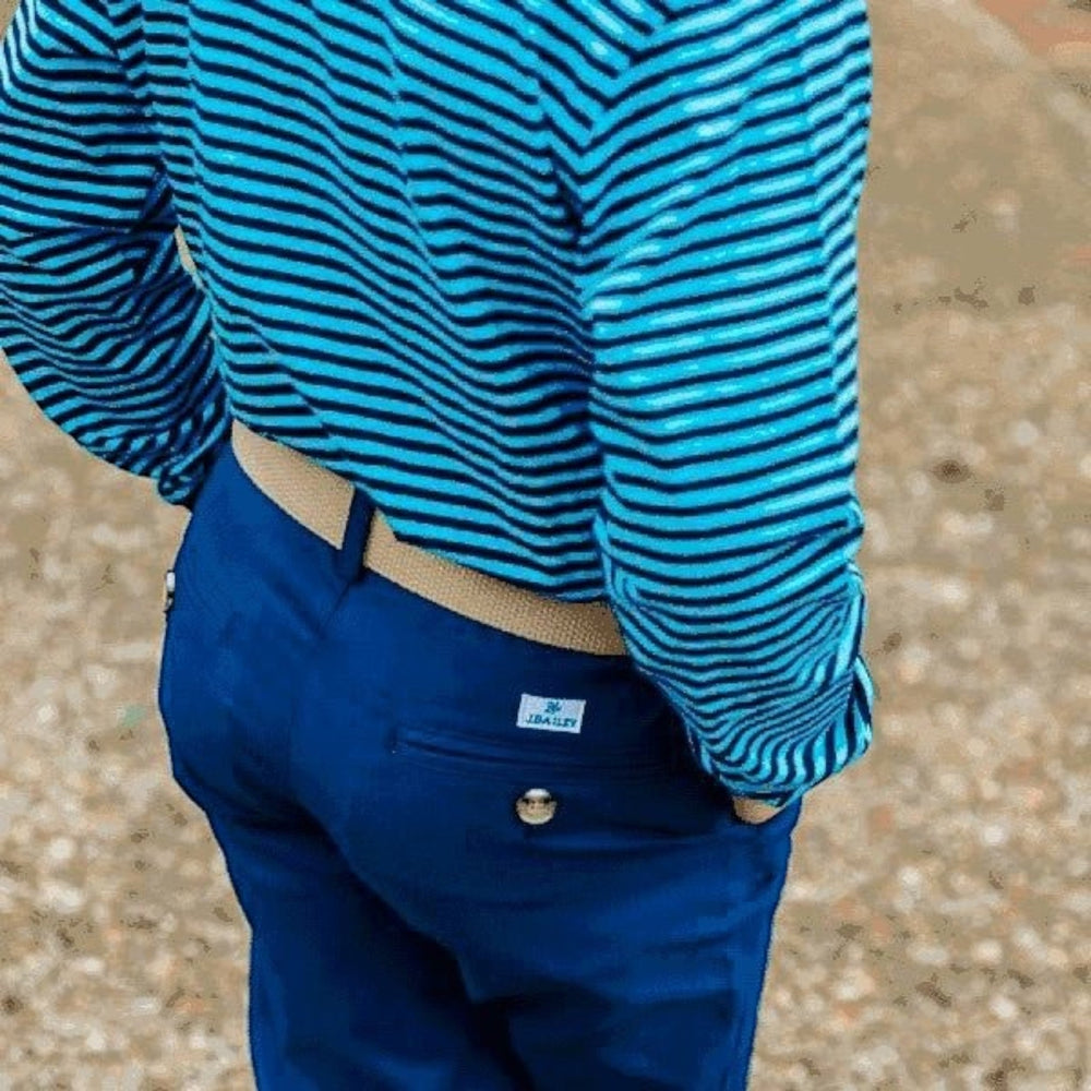 That Store J Bailey khaki adjustable belt worn with blue trousers and a striped shirt for a polished boy's outfit