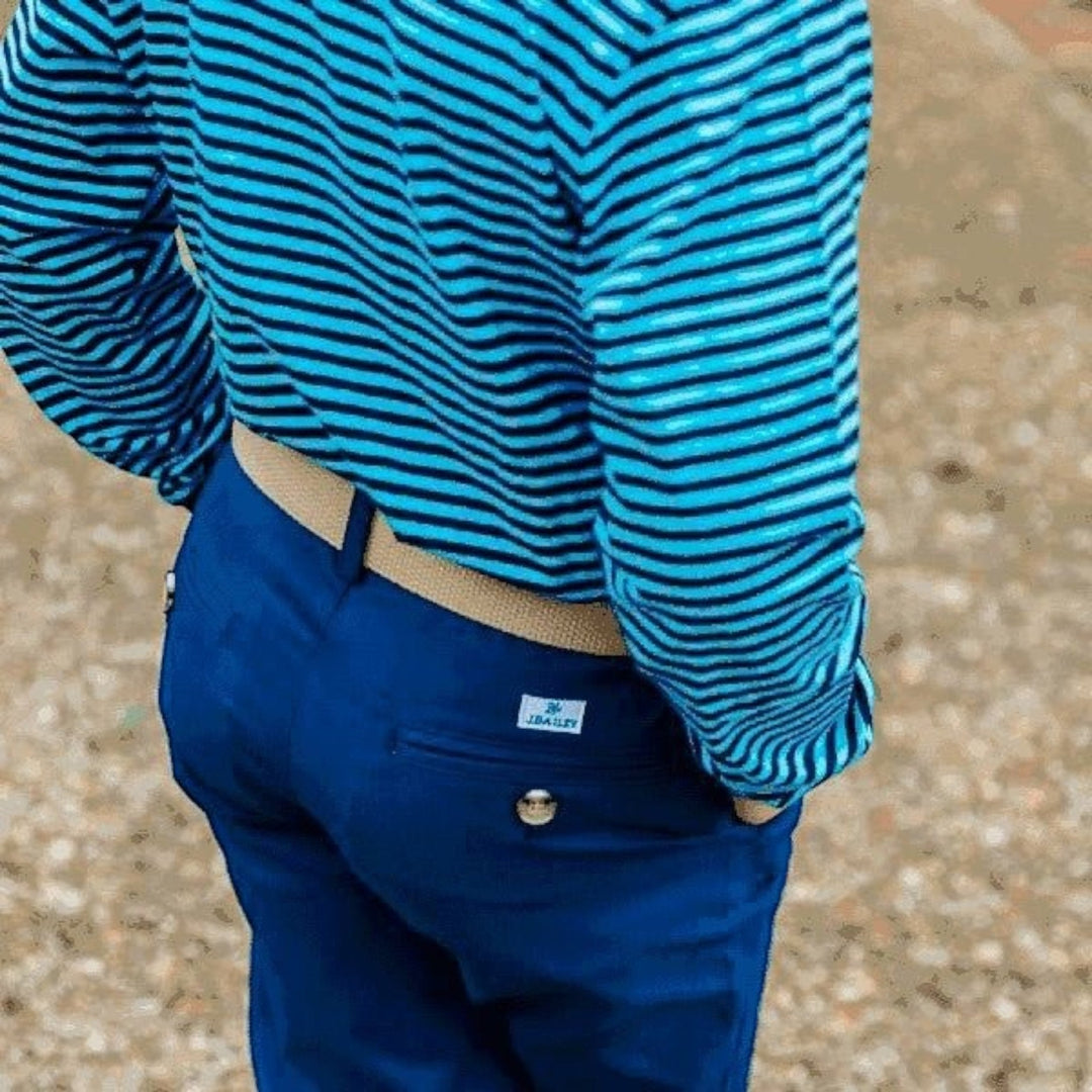 That Store J Bailey khaki adjustable belt worn with blue trousers and a striped shirt for a polished boy&
