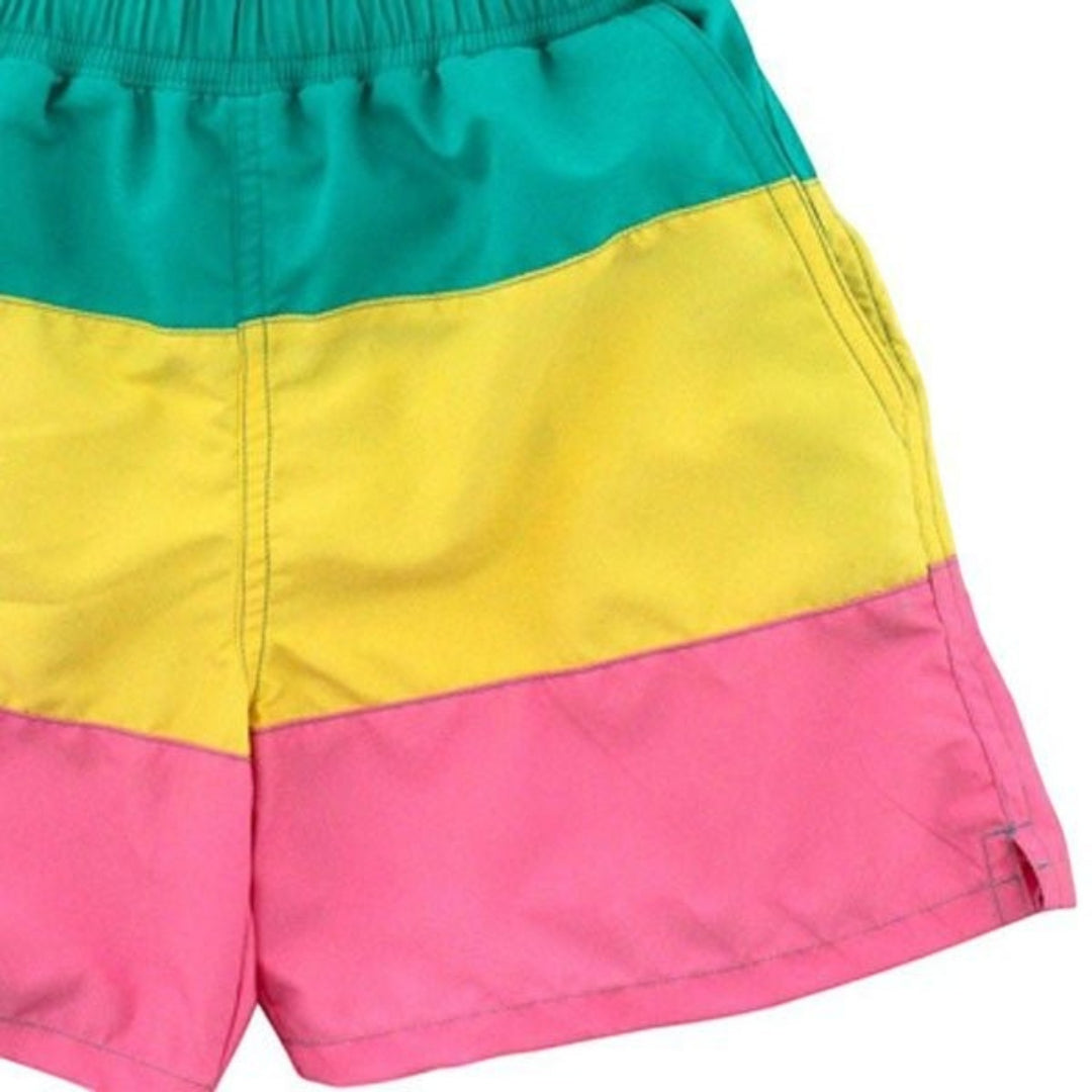 That Store J Bailey Retreat swim trunks featuring a color-blocked design in teal, yellow, and pink quick-dry fabric.