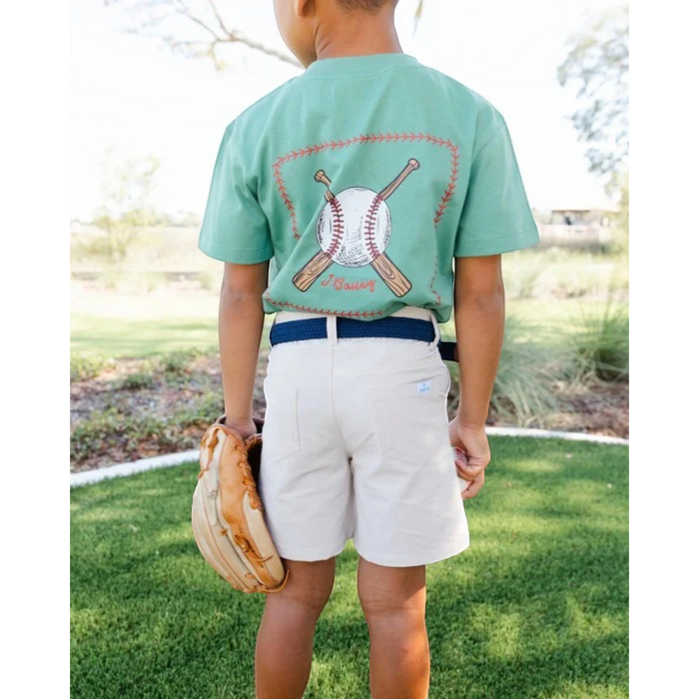 That Store khaki performance boys club shorts with elasticized waistband and snap closure worn by a child outdoors