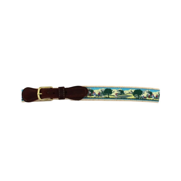 That Store adjustable kids belt featuring a colorful golf course scene with a brown leather tab and gold buckle
