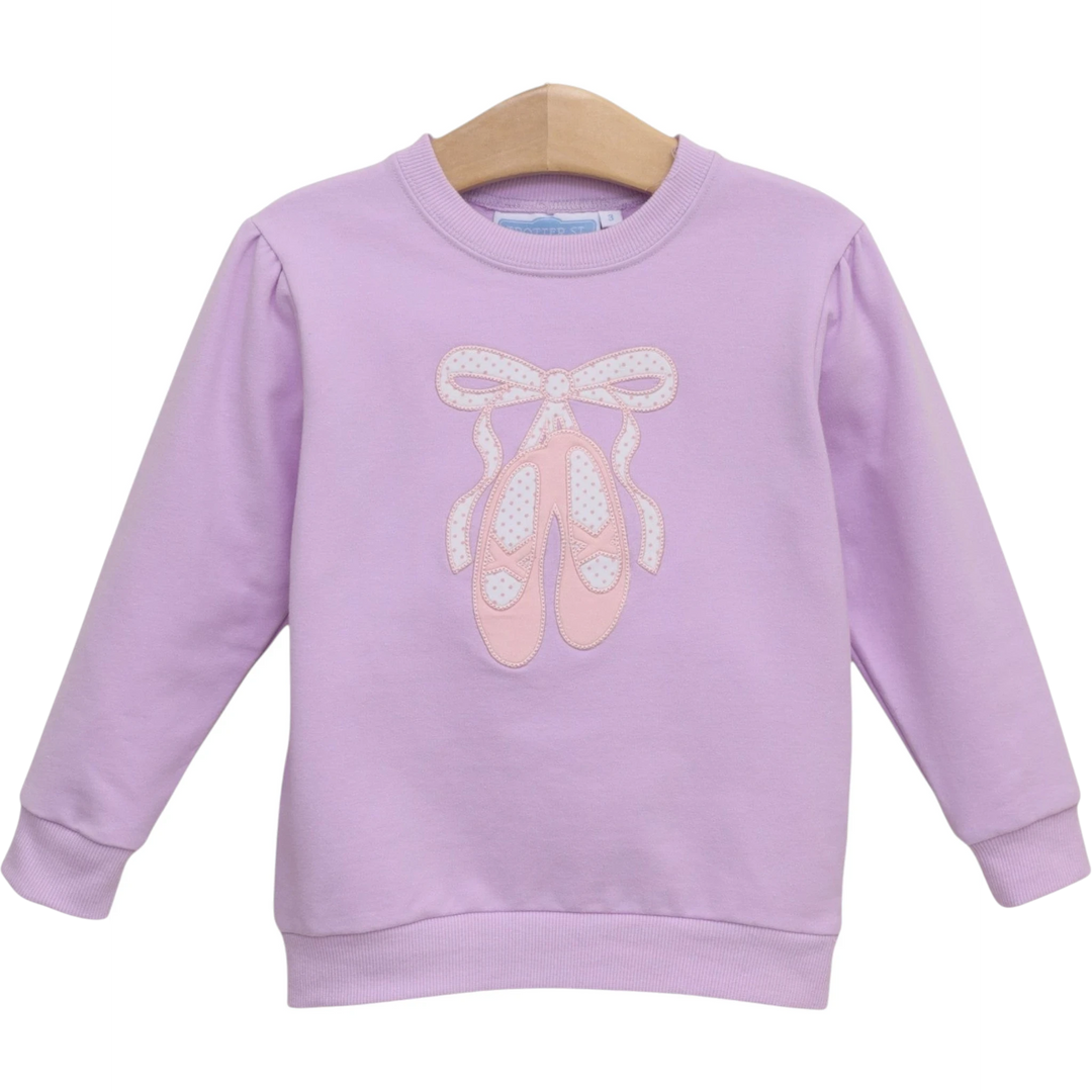 That Store lavender French terry girls pullover featuring a delicate pink ballet shoe embroidery and bow detail