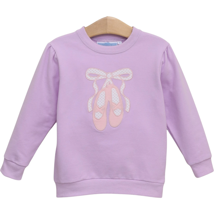 That Store lavender French terry girls pullover featuring a delicate pink ballet shoe embroidery and bow detail