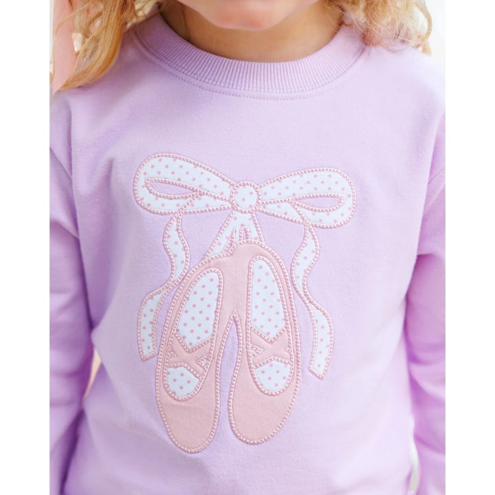 That Store lavender French terry girls pullover featuring a white and pink polka dot ballet shoe embroidery design.