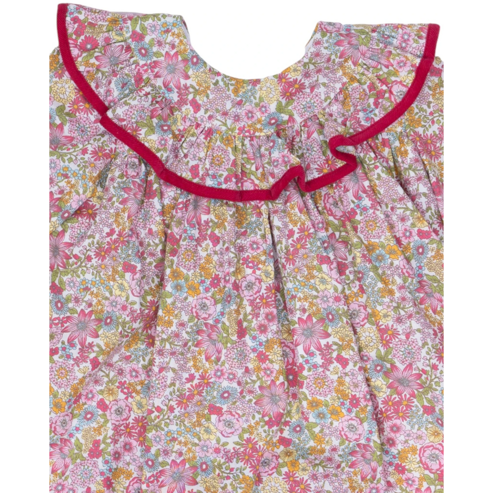 That Store Layla girls dress featuring a raspberry floral print with a ruffled collar and vibrant pink trim.