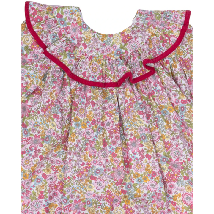 That Store Layla girls dress featuring a raspberry floral print with a ruffled collar and vibrant pink trim.