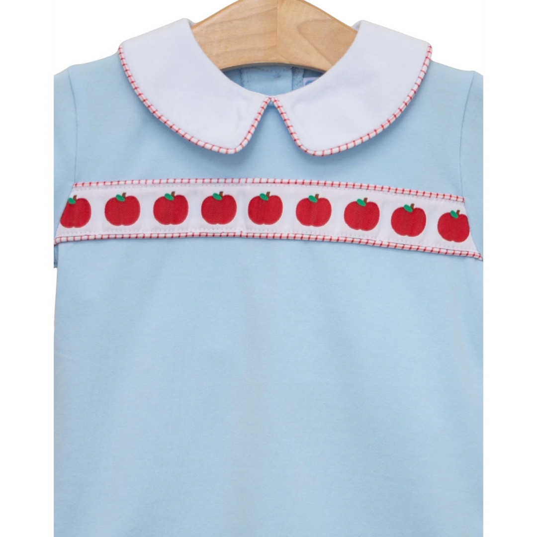 That Store boys light blue cotton shirt with a white Peter Pan collar and red apple ribbon banding detail