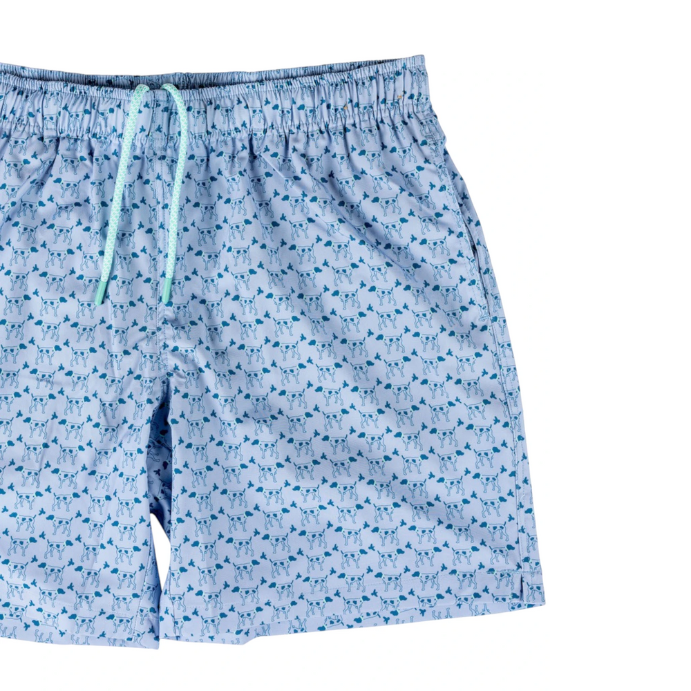 That Store youth swim trunks in light blue with a playful dark blue dog pattern, featuring an elastic drawstring waist