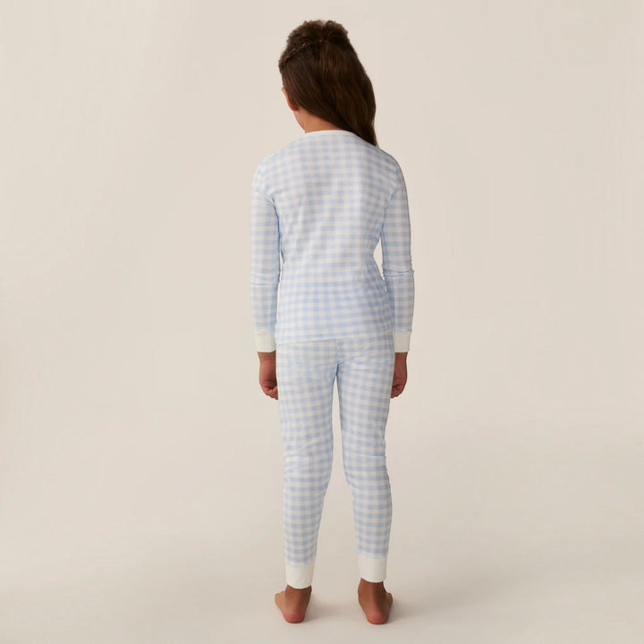 Child wearing That Store light blue gingham Pima cotton long sleeve pajama set, back view