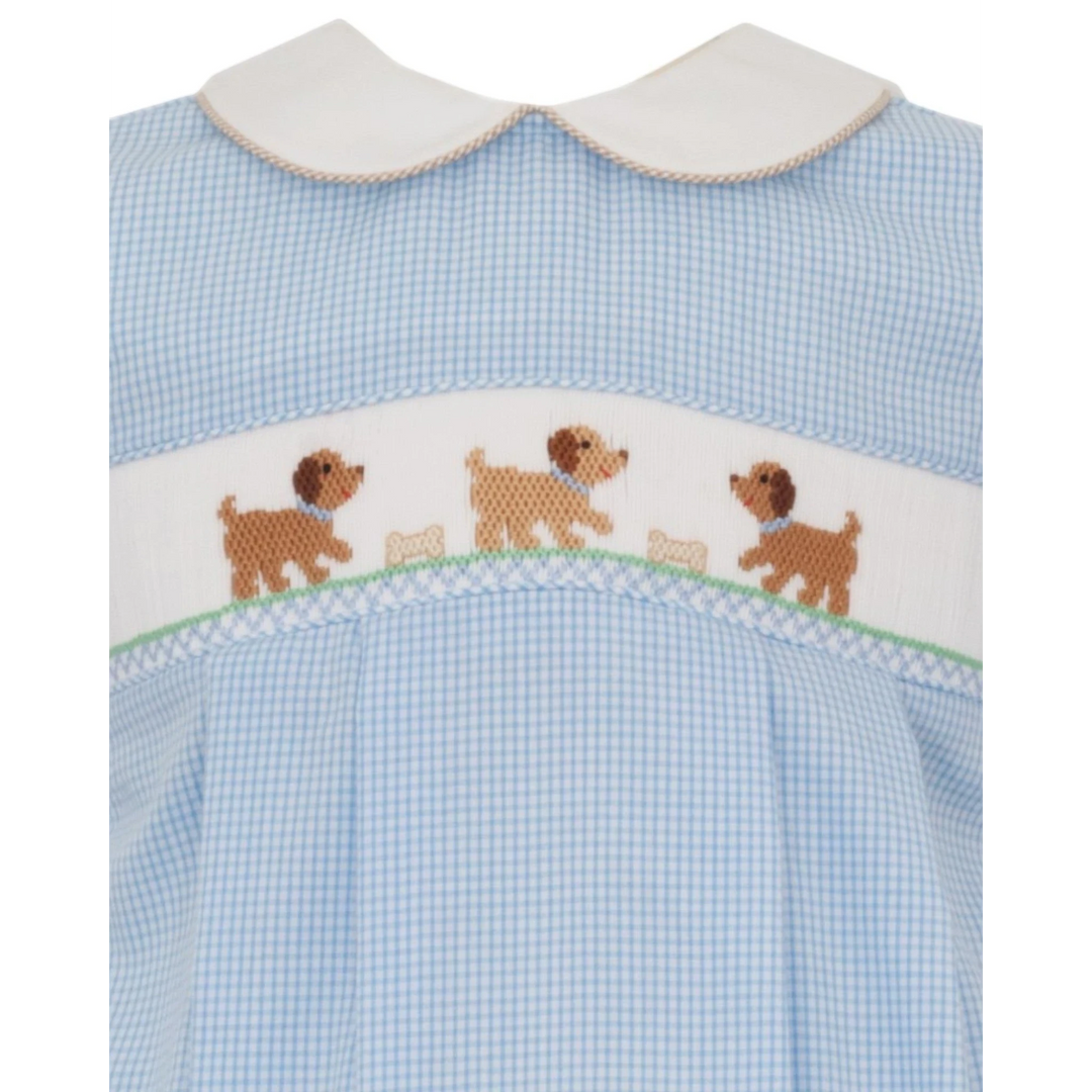 That Store light blue gingham boys bubble with hand-smocked puppy embroidery and a white Peter Pan collar.