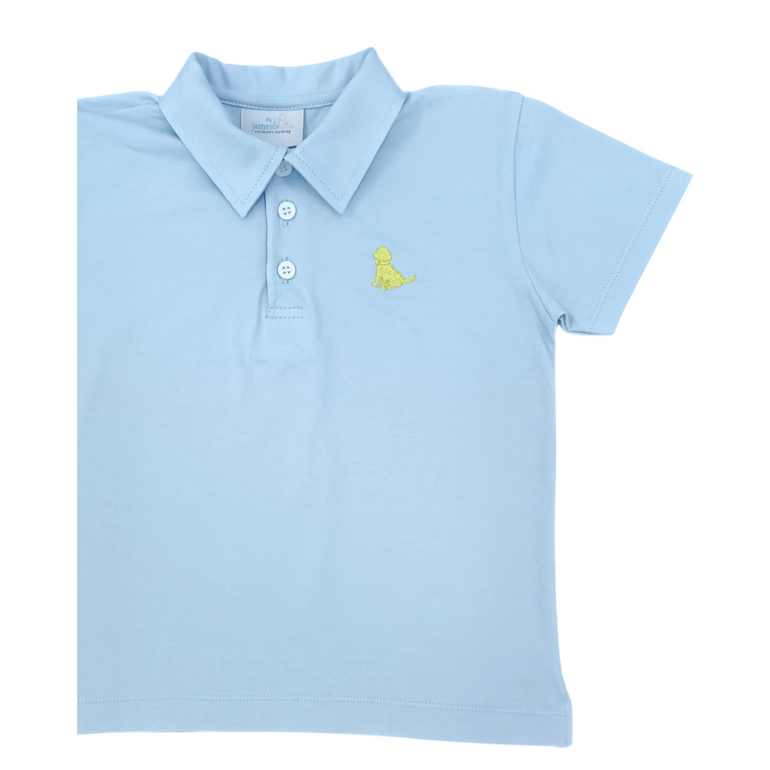That Store light blue polo shirt for children featuring a yellow embroidered puppy on the chest with button placket