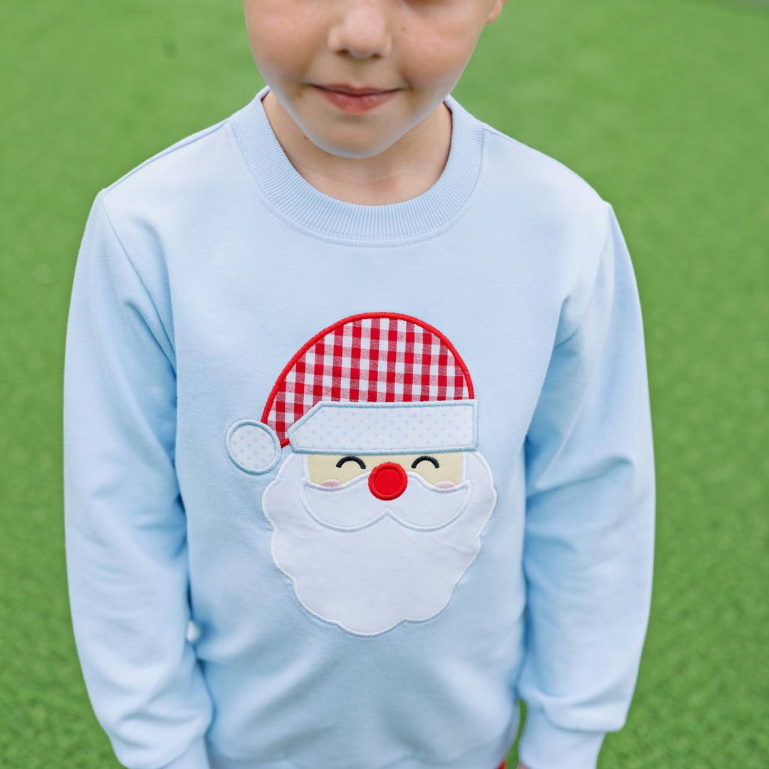 That Store light blue French terry boys pullover featuring a festive Santa Claus applique with a red gingham hat
