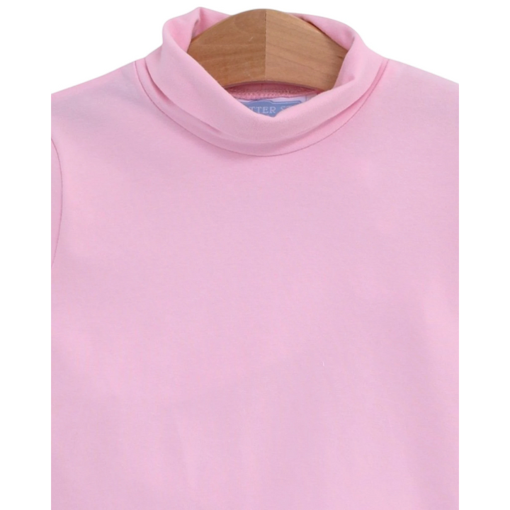 That Store light pink girls turtleneck made from soft cotton spandex blend on a wooden hanger