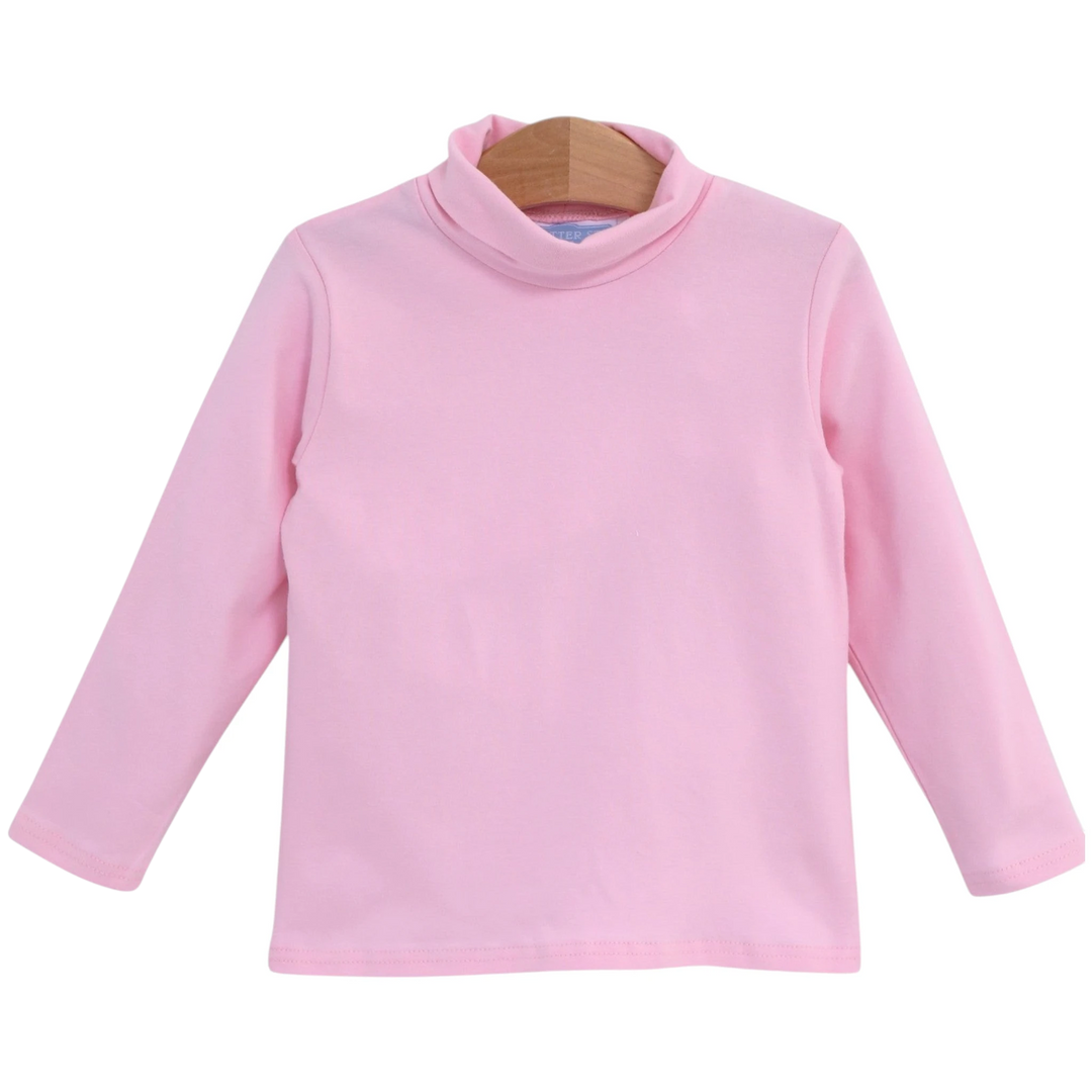 That Store light pink girls turtleneck made from soft cotton and spandex blend on a wooden hanger