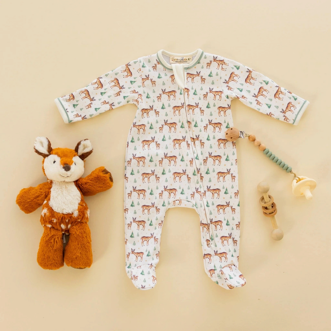 Luna &amp; Arlo ivory Pima cotton footie with woodland deer print, moss green trim, and front zip closure.