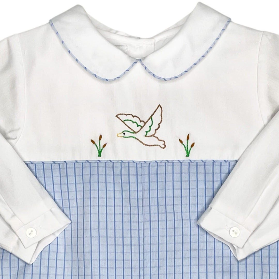 That Store longall with white bodice, mallard duck embroidery, Peter Pan collar, and light blue windowpane fabric.