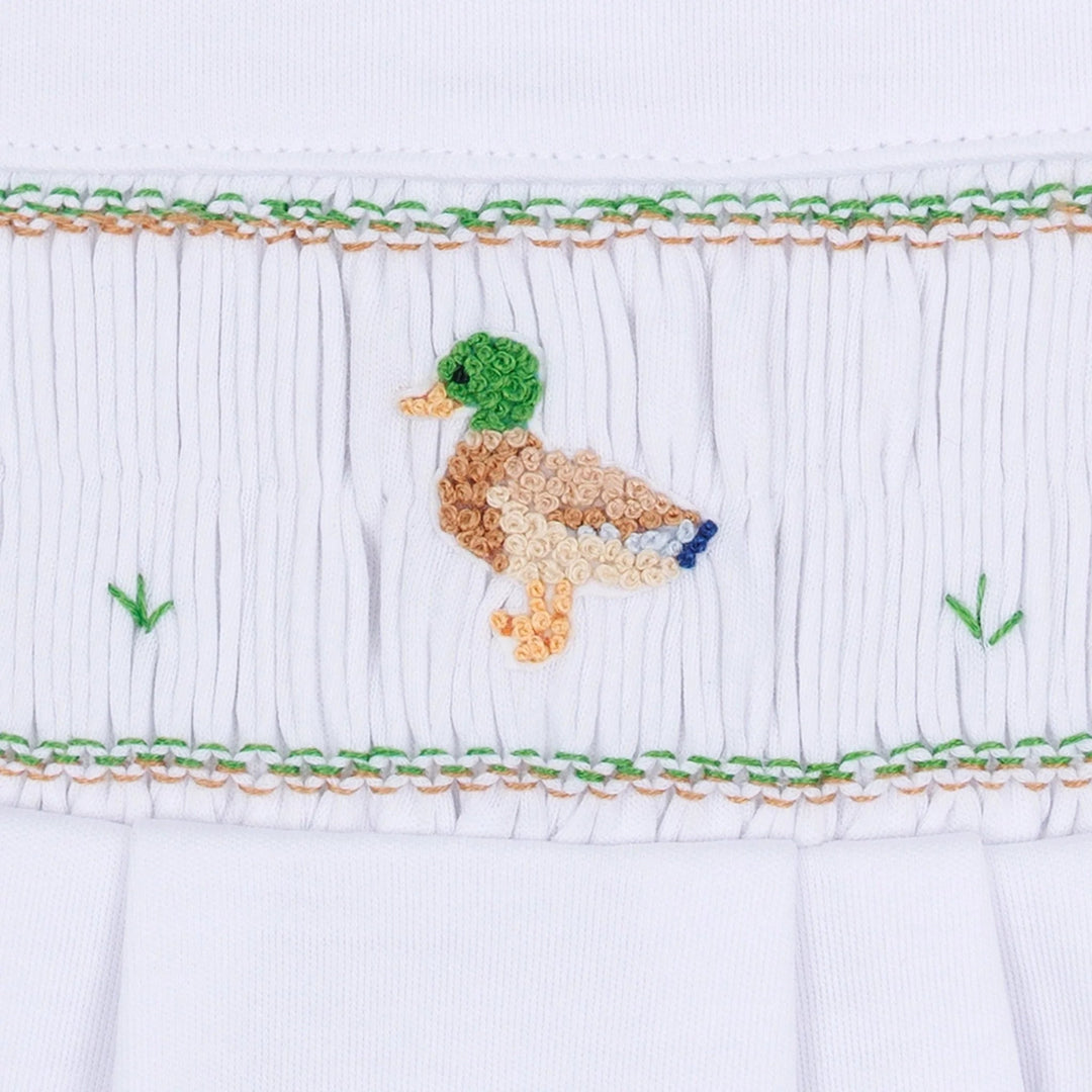 That Store boys smocked footie in white Pima cotton featuring a detailed embroidered mallard duck design