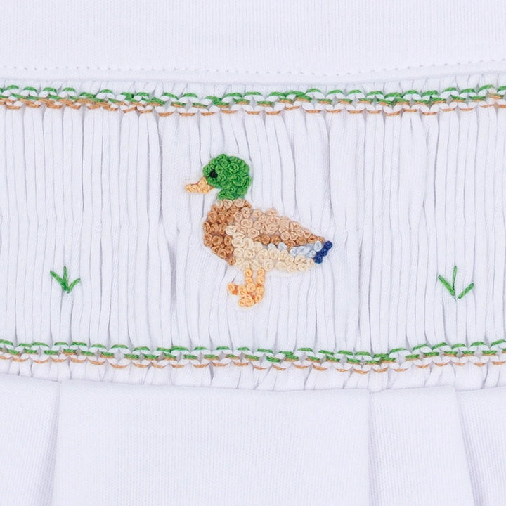 That Store boys smocked footie in white Pima cotton featuring a detailed embroidered mallard duck design