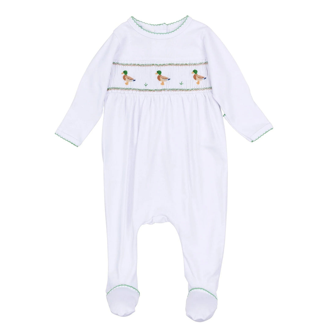 That Store white Pima cotton baby footie with green trim and a smocked mallard duck pattern across the chest.