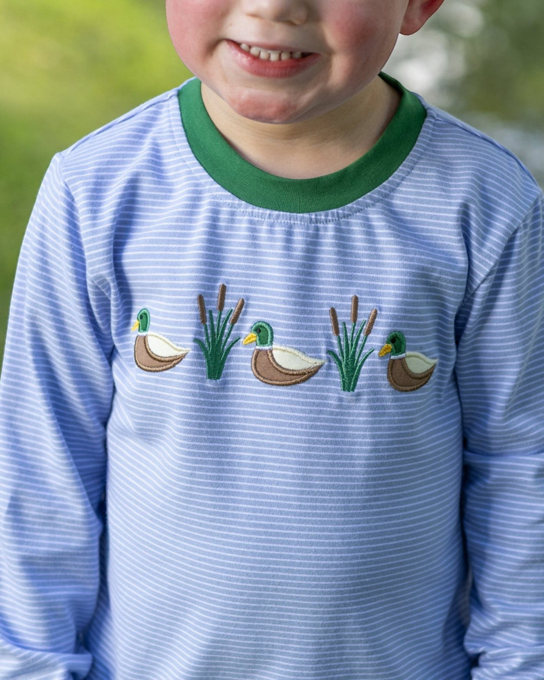 That Store boys blue stripe long sleeve shirt with mallard duck and cattail embroidery and green crew neck collar
