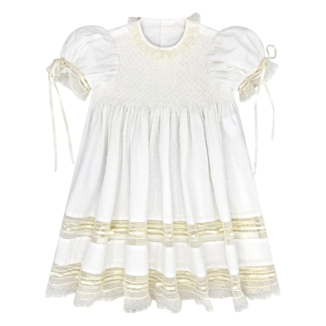 That Store Margaret white Swiss dot dress with ecru lace trim, puff sleeves, and smocked bodice for special occasions.