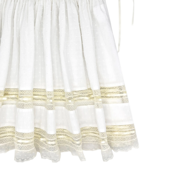 That Store Margaret white Swiss dot dress featuring delicate ecru lace trim and ribbon detailing on the skirt hem.
