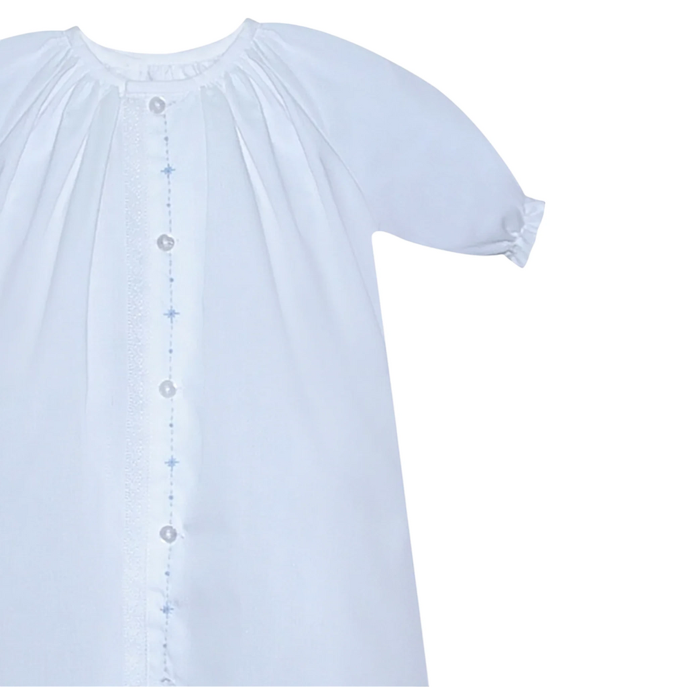 That Store Marlow white newborn daygown with blue embroidered diamond details and delicate lace trim.