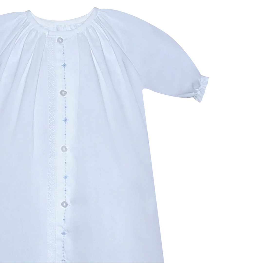 That Store Marlow white newborn daygown with blue embroidered diamond details and delicate lace trim.