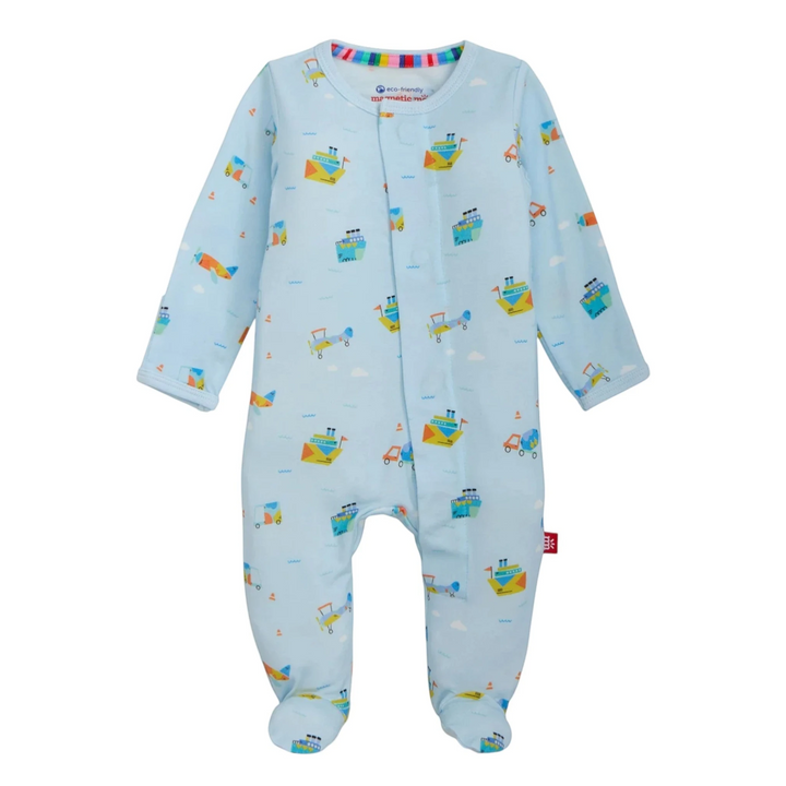 That Store light blue modal baby footie with colorful boat and plane print and magnetic closures for easy changes.