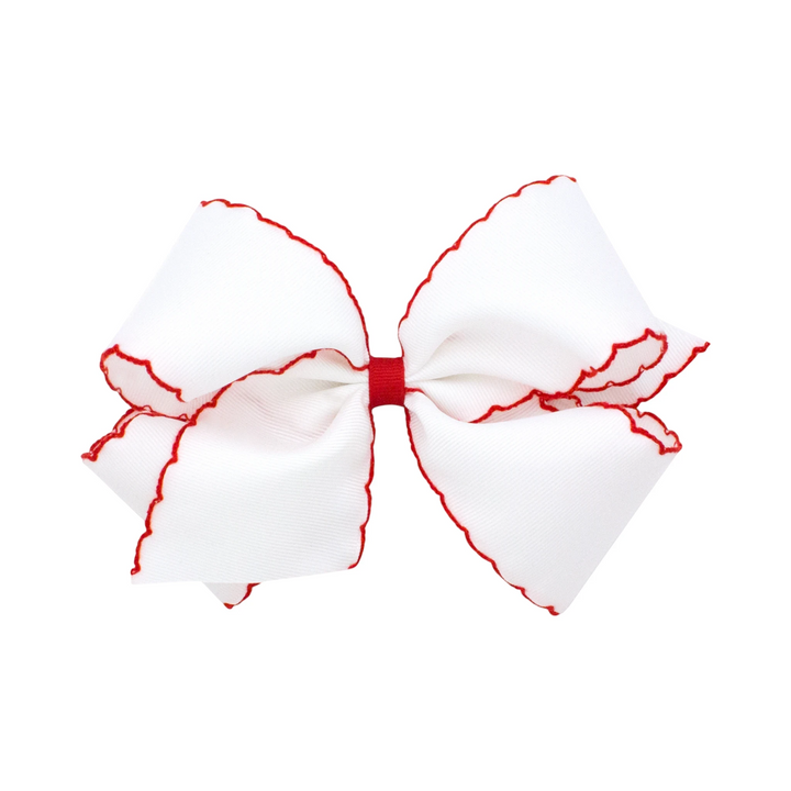 That Store Moonstitch medium grosgrain hair bow in white with red contrasting scalloped edges and a no-slip clip.