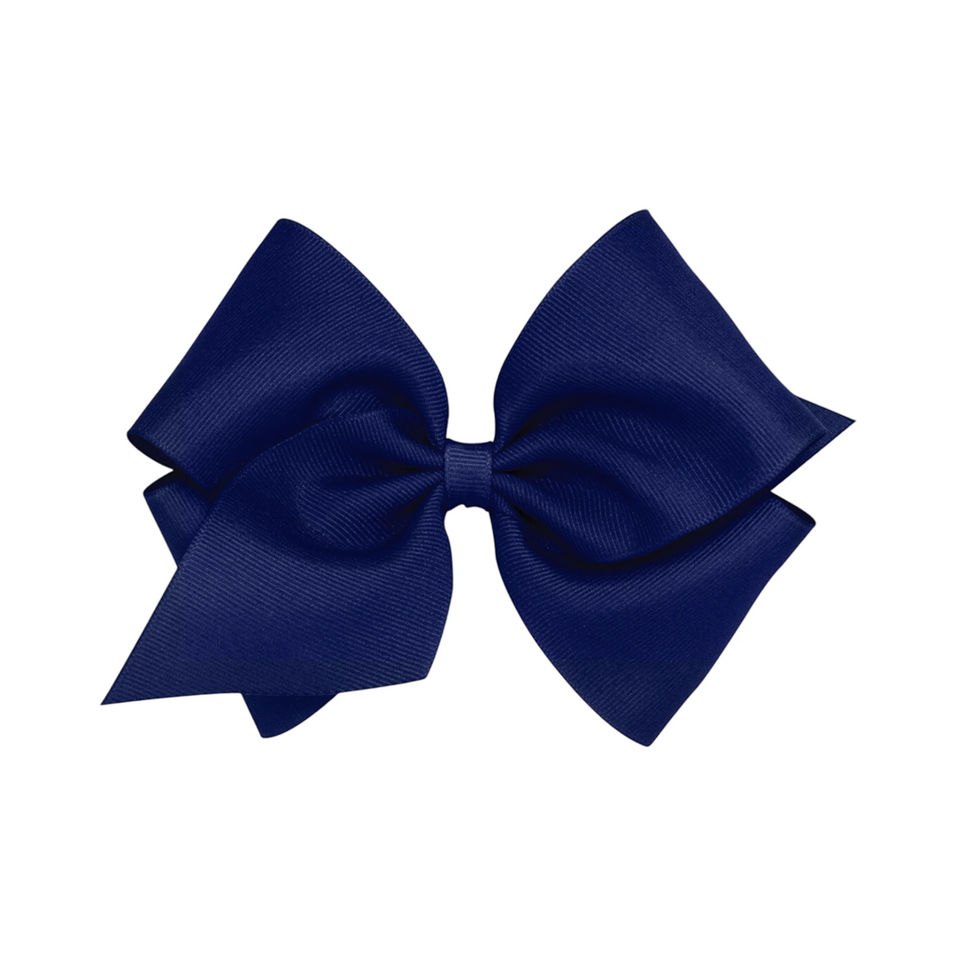 That Store small navy blue grosgrain hair bow with a no-slip alligator clip for toddlers and girls